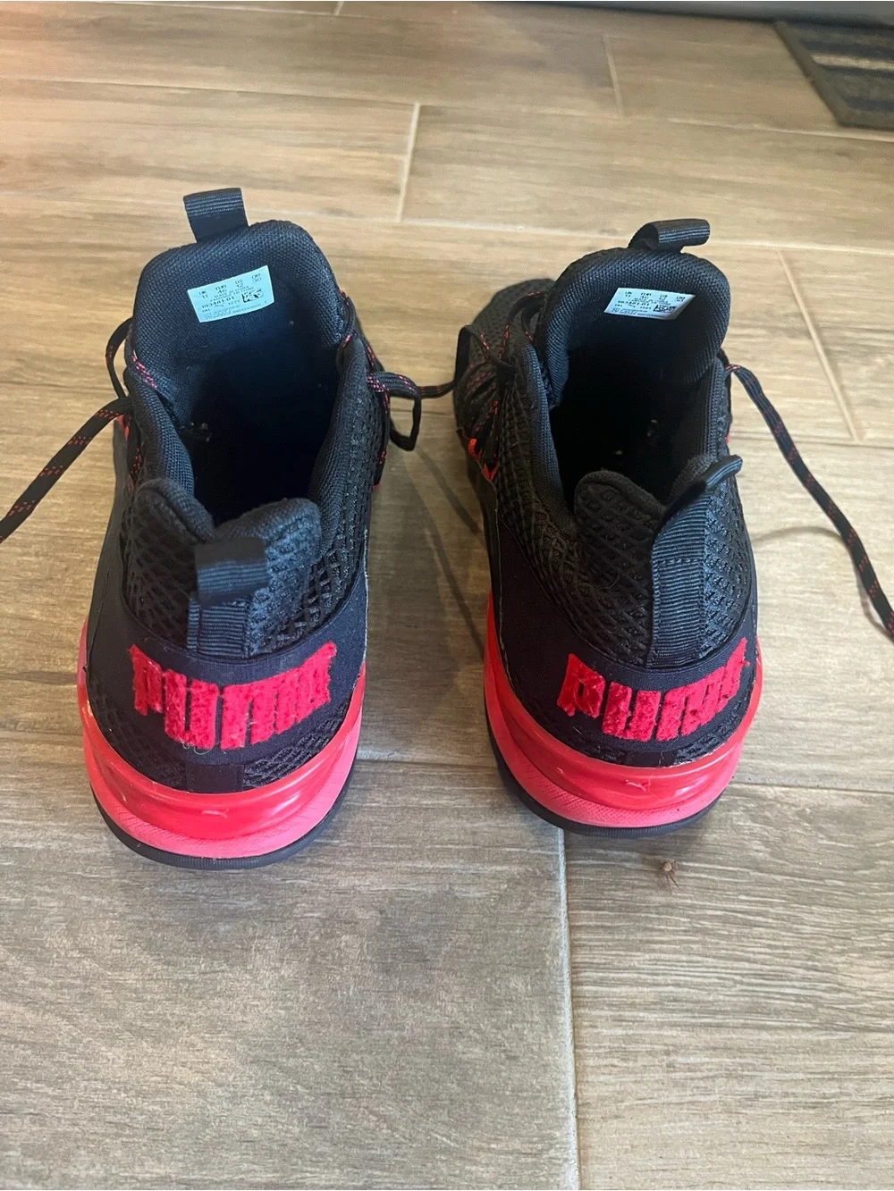 Puma Black Sneakers with Red Accent Logos